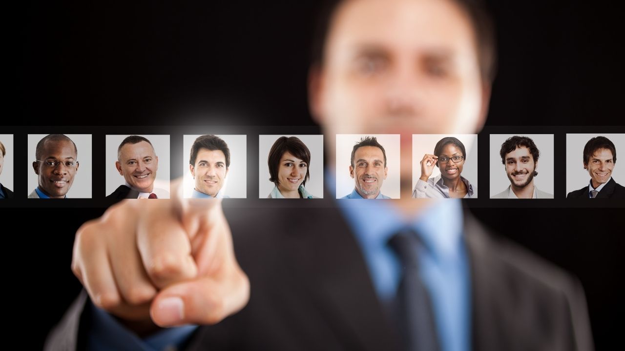 man pointing at pictures